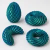 Œuf fidget dragon transformable – DRAGOEGG Bleu-Vert Voir les images du produit 9