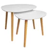 A set of two nesting tables with white tops and wooden legs, isolated on a white background. Produktbild-Vorschau