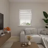 A living room scene with a sectional sofa, coffee table, and a window with blinds. Produktbild-Vorschau