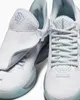 A close-up studio shot of a pair of white Converse All Star Bb Trilliant Cx Ox sneakers. Produktbild-Vorschau