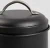 Close-up of the lid and handle of a black container. Produktbild-Vorschau