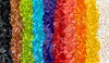 A top-down view of a large collection of colorful LEGO bricks sorted into vertical stripes by color. Produktbild-Vorschau