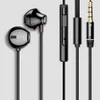 A product shot of black earphones with their remote and audio jack. Podgląd zdjęcia produktu
