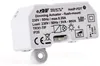 A close-up, angled view of a white electronic device with text and symbols printed on it. Produktbild-Vorschau
