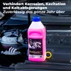 A bottle of pink coolant is placed in the engine bay of a car. Produktbild-Vorschau
