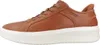 A side view of a brown leather sneaker with a white sole. Náhled obrázku produktu