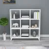 A white cube shelf unit filled with decorative items and books, placed against a gray wall. Produktbild-Vorschau