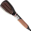 A close-up, studio shot of a black and rose gold hair straightening brush against a white background. Produktbild-Vorschau