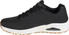 A side view of a single black sneaker. Anteprima dell’immagine prodotto