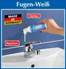 A bathroom sink with a faucet, showing a 'before and after' application of a joint whitening product. The product is being applied by a hand in the 'before' section. Produktbild-Vorschau