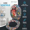 A toilet seat with a graffiti-style design, featuring the Rolling Stones tongue logo, is displayed open. The background shows a blurred bathroom shelf. Text overlays highlight product benefits. Náhled obrázku produktu