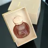 A perfume bottle is presented in an open box. Voir les images du produit