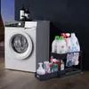 A washing machine and a two-tier organizer filled with cleaning supplies are shown in a laundry room setting. Náhled obrázku produktu