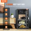 A VEVOR safe box is shown open, displaying various valuables like cash, jewelry, firearms, gold, and a passport. The safe is placed on a wooden cabinet next to a potted plant, with a large screen displaying a landscape in the background. Anteprima dell’immagine prodotto