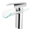 A close-up studio shot of a modern chrome and glass waterfall faucet. Náhled obrázku produktu