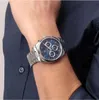 A close-up shot of a man's wrist wearing a silver Maserati watch with a blue dial. Anteprima dell’immagine prodotto