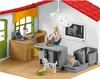 A toy veterinary clinic playset with figures and animals. Podgląd zdjęcia produktu