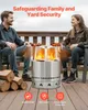 A couple sits on a deck around a stainless steel fire pit with flames. Produktbild-Vorschau