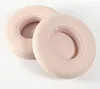 Two pink ear pads for headphones are shown on a white background. Náhled obrázku produktu