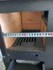 A close-up view of the interior of a wood-burning stove, with a tape measure placed across the grate. Produktbild-Vorschau