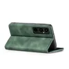 A green flip case for a smartphone is shown from a side-angle, with the phone inserted and the cover folded back to act as a stand. Produktbild-Vorschau