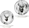 A set of plates with a deer motif against a wood-grain background. Produktbild-Vorschau