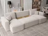 A modern sectional sofa with storage is shown in a living room setting. Produktbild-Vorschau