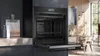 A modern kitchen scene with an open built-in oven as the focal point. Produktbild-Vorschau