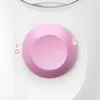 A close-up of a pink dial on a white appliance. Produktbild-Vorschau