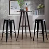 A set of black bar stools and a dark wood bar table with decorative items on top, set against a neutral background. Náhľad obrázku produktu