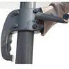 A close-up view of the crank mechanism and handle of an outdoor umbrella. Produktbild-Vorschau