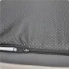 A close-up view of the textured underside of a gray dog bed, showing a zipper closure. Produktbild-Vorschau