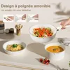 A kitchen counter with cookware and food. Anteprima dell’immagine prodotto