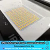 Close-up of a white LED floodlight with water droplets on its surface, showing the array of LED lights. Náhled obrázku produktu