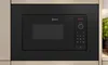 A close-up of a built-in black microwave oven. Anteprima dell’immagine prodotto