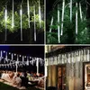 Collage of images showing white LED meteor shower lights used for decoration outdoors and on a Christmas tree. Náhled obrázku produktu