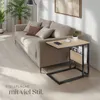 A side table next to a sofa in a living room. Produktbild-Vorschau