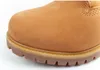 A close-up view of the toe and sole of a tan work boot. Produktbild-Vorschau