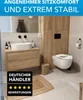 A modern bathroom with a sink, toilet, and wooden vanity. Produktbild-Vorschau
