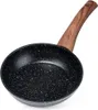 A black frying pan with a speckled surface and a wooden handle is shown against a white background. Produktbild-Vorschau