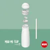 An exploded view of a baby bottle's components against a green background. Anteprima dell’immagine prodotto