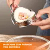 A person is using a dumpling maker to form a dumpling over a bowl. Produktbild-Vorschau