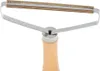 A close-up shot of a lint remover with a wooden handle. Náhľad obrázku produktu