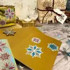 A festive Christmas scene with gifts, decorations, and snowflake confetti. Produktbild-Vorschau