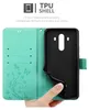 A hand holding a turquoise phone case open to reveal the inside and the phone holder. Náhľad obrázku produktu