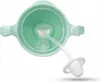 The image shows the inside of a green baby bottle with a straw and teat. Produktbild-Vorschau