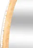 A close-up view of the edge of a round LED mirror with a bamboo frame. Podgląd zdjęcia produktu