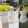 A collage showing a white garden stool in different weather conditions: sunny spring/summer, snowy winter, and rainy autumn. Anteprima dell’immagine prodotto