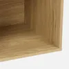 A close-up view of the corner of a wooden shelf or storage unit. Anteprima dell’immagine prodotto