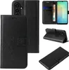 A collage of images showing a black flip phone case with floral and butterfly embossing, displaying its various features and angles. Produktbild-Vorschau